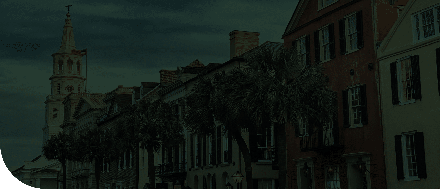 palm trees in front of a row of houses in Charleston